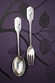 K&Co. presents: Children's cutlery, spoon and fork in silver (stamped) with stork motif at the top of the handle...