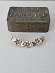 Vintage silver brooch shaped like a vine with flowers ...