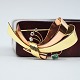 Antik Damgaard-Lauritsen presents: Viggo Wollny; A brooch in 14k gold and rose gold set with diamonds and emerald