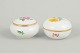 L'Art presents: Meissen, set of two lidded jars with polychrome flower decoration.