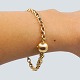Antik Damgaard-Lauritsen presents: Ole Lynggaard; Small "Eight" Bracelet of 14k gold, with round clasp