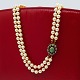 Antik Damgaard-Lauritsen presents: Pearl necklace with a 14k gold clasp, set with emerald and diamonds