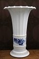K&Co. presents: White Hetsch vase with Blue Flower motif from Royal Copenhagen. Stamp year 1960...
