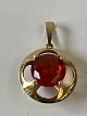 Antik Huset presents: Pendant in 14 carat gold, with inlaid orange stone, designed by Hermann Siersbøl
