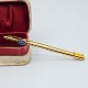 Antik Damgaard-Lauritsen presents: Brooch in 14k gold set with a sapphire