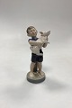 Danam Antik presents: Royal Copenhagen Monthly Figurine August - Boy with Piglet No. 4530