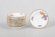 L'Art presents: Royal Copenhagen Saxon Flower, set of eight butter pads or caviar dishes.