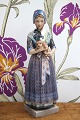 K&Co. presents: Dahl Jensen porcelain figurine of a Havdrup girl in Danish folk costume with a small dog...