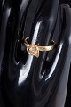 L'Art presents: 8 carat gold ring with white stone.
