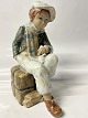 Antik Huset presents: Sitting boy, Figurine Spanish.Height 27.5 cm.