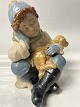 Antik Huset presents: Sitting boy with dog, Figurine Nedal Spanish.Height 23.5 cm.
