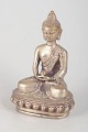 L'Art presents: Silver-plated metal Buddha figure.