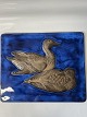 Antik Huset presents: Relief of ceramics with a motif of ducks on a blue background.560/2903