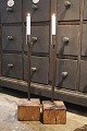 K&Co. presents: Old candlestick with wrought iron candle holder standing on old wooden base in solid oak...