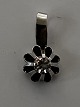 Pendant in silver with inlaid clear stone.Height: 1.2 cm