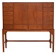 Aabenraa Antikvitetshandel presents: Chest of drawers designed by Knud Juul Hansen, crafted in teak. The piece ...