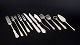 L'Art presents: Set of twelve pieces of serving flatware by various makers.