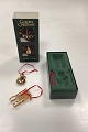 Danam Antik presents: Georg Jensen Golden Christmas Holiday Ornament - Snowman and Sledge 2004