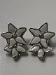 Antik Huset presents: Clip earrings with white enamel flowers in sterling silver.Measures 2.3x2.2 cm