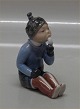 Royal Copenhagen figurine 2834 RC Greenland Girl  By Georg K. Strand in 1927
