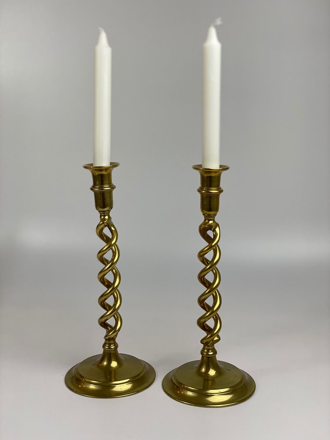  Pair of large, English, antique, open barley twist brass  candlesticks for standard-size candles.