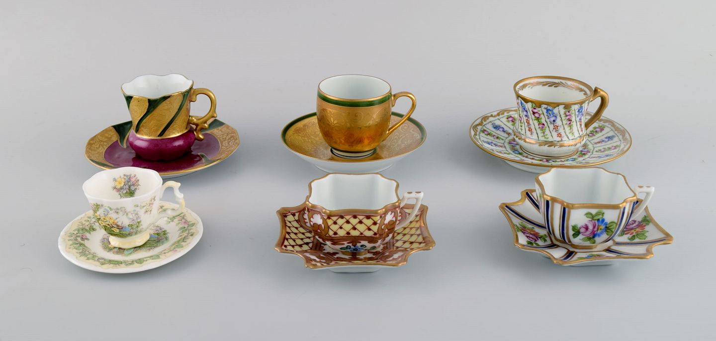  Limoges, France and Royal Doulton, England. Six mocha /  decoration cups in hand-painted porcelain wi