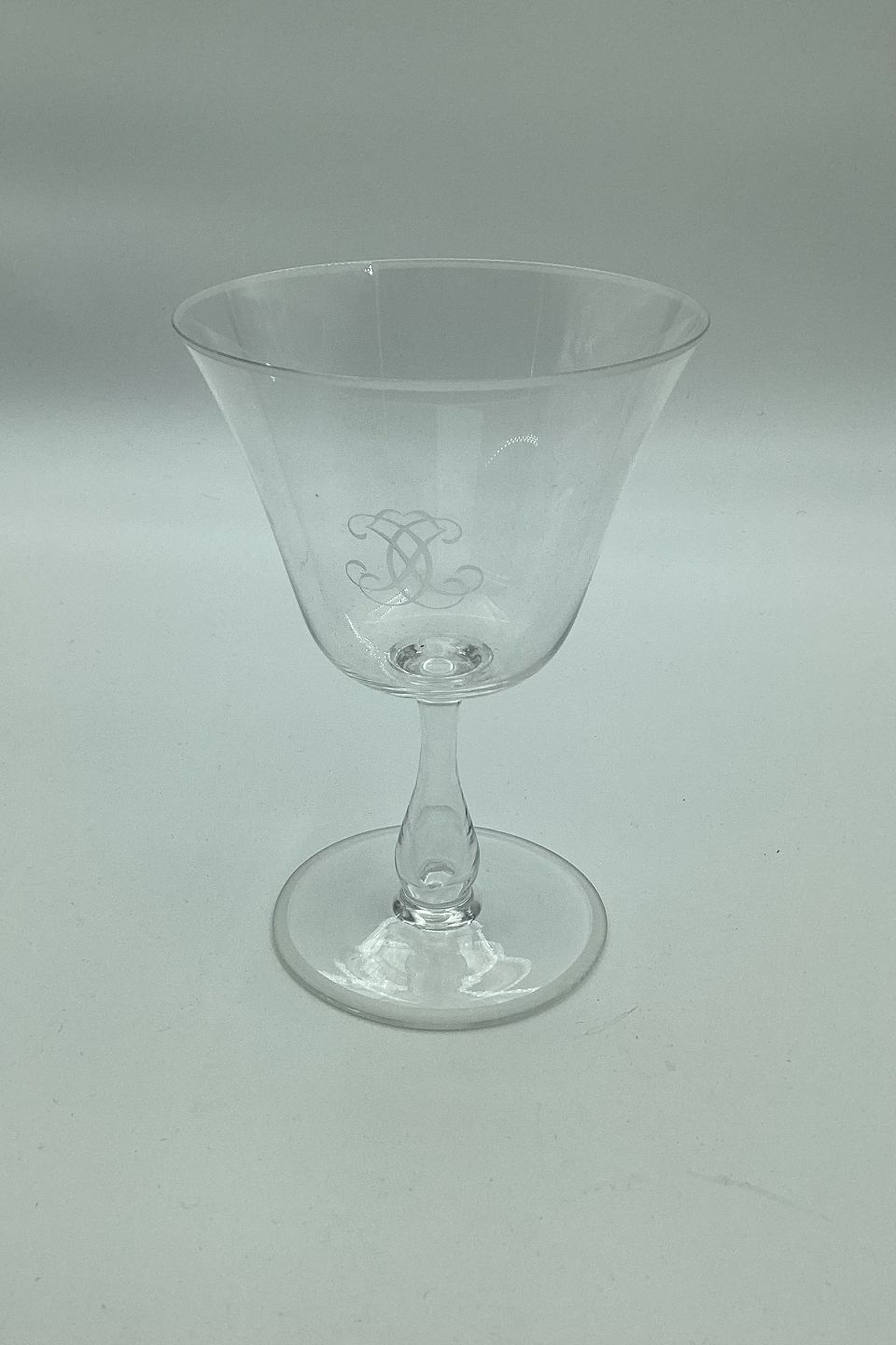  Wine glass with monogram on bell-shaped basin and hollow  stem