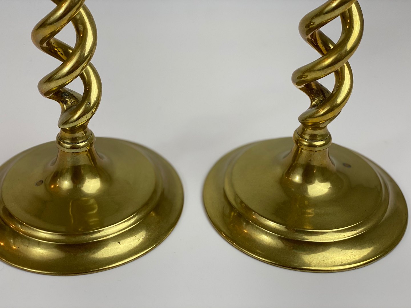  Pair of large, English, antique, open barley twist brass  candlesticks for standard-size candles.
