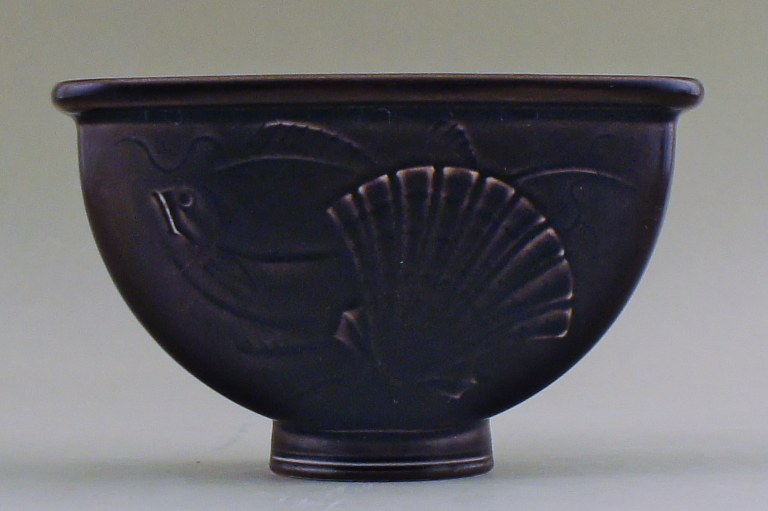 Aluminia flowerpot holder in earthenware, brown with fish and seashell motif. 
Number 1602.