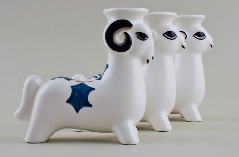 3 Royal Copenhagen faience candlesticks, Christmas bucks. 
