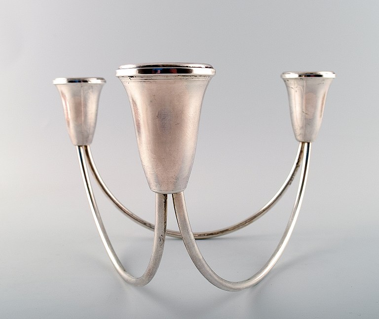 Duchin sterling, Usa, three-armed candlestick in modern design.
