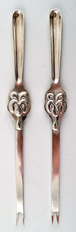 2 art nouveau lobster forks.
