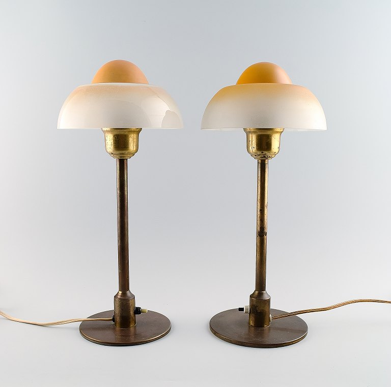 Fog & Mørup : A pair of fried eggs tablelamps. Brass frames with glass shades.
