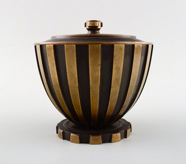 Tinos style art deco lidded jar in bronze.
