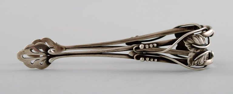 Rare Georg Jensen sugar tongs, richly ornamented.
Design 101.