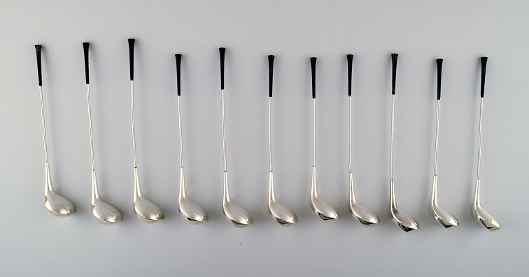11 Danish design drink coolers. Shaped like golf clubs. Nickel silver.
