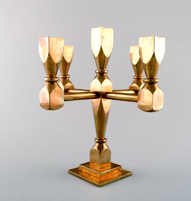 Gusum metal, candlestick of brass for five lights.
