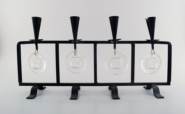 Erik Höglund for Kosta Boda, candleholder in cast iron with mouth blown glasses.