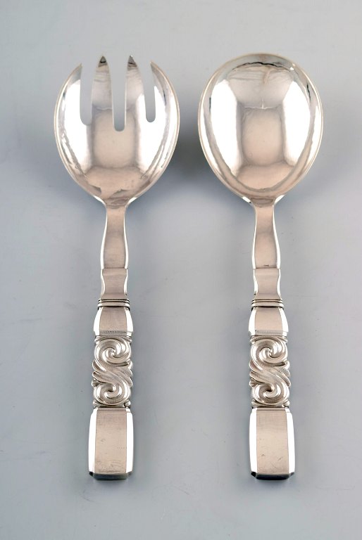 Georg Jensen. Cutlery, Scroll No. 22, hammered sterling silver salad set in full 
silver.