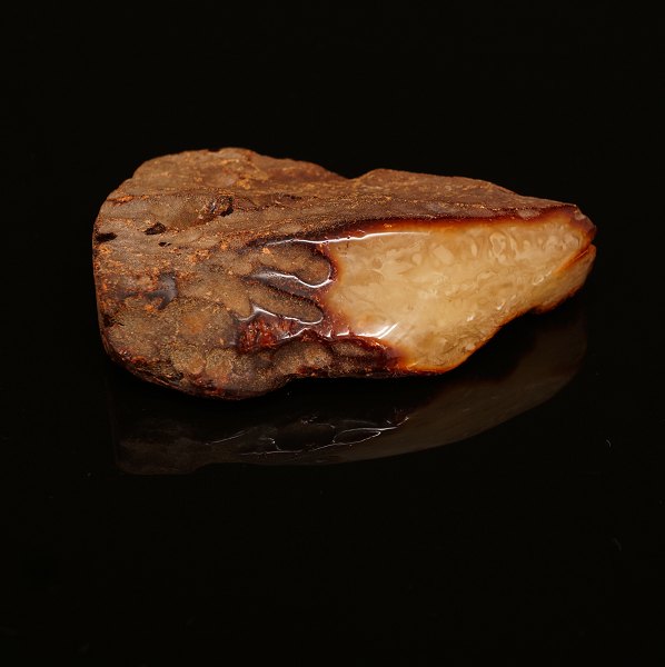 A large piece of Amber, milk white. Size: 13x10x3,5cm. W: 217