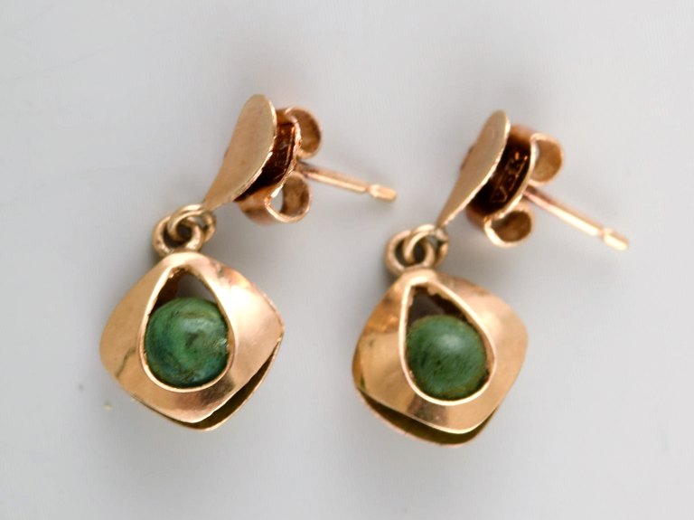 Danish 14K gold ear studs with green stones. Mid-1900s.
