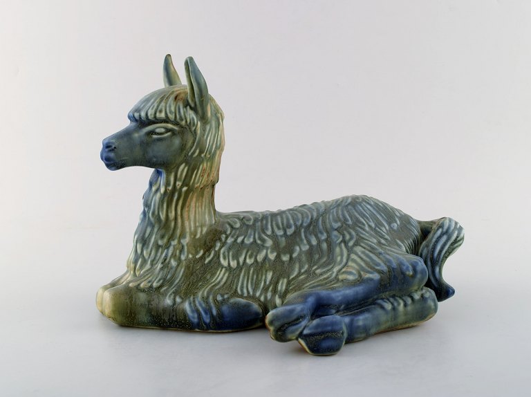 Rare Rörstrand stoneware figure by Gunnar Nylund. Lying lama.
