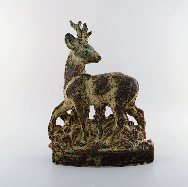 Knud Kyhn for Royal Copenhagen. Very large stoneware figure of standing deer, 
no. 21333,