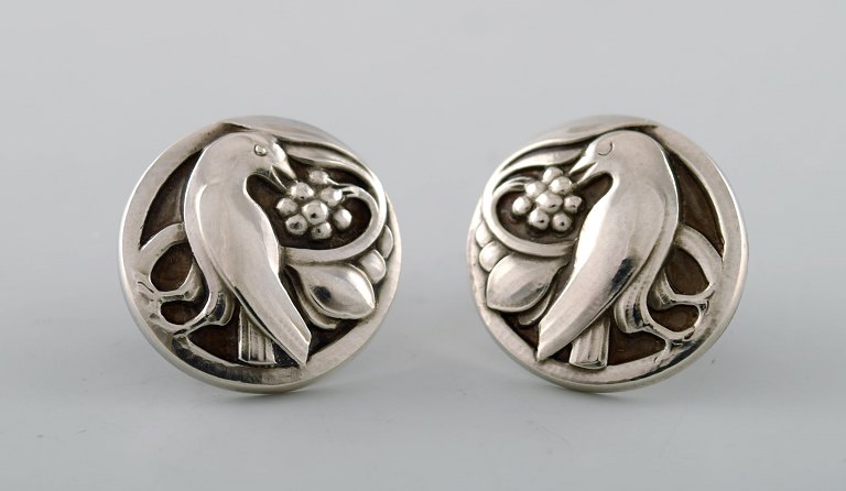 A pair of earrings in sterling silver by Georg Jensen. Design number 54. Bird 
motif and grapes.
