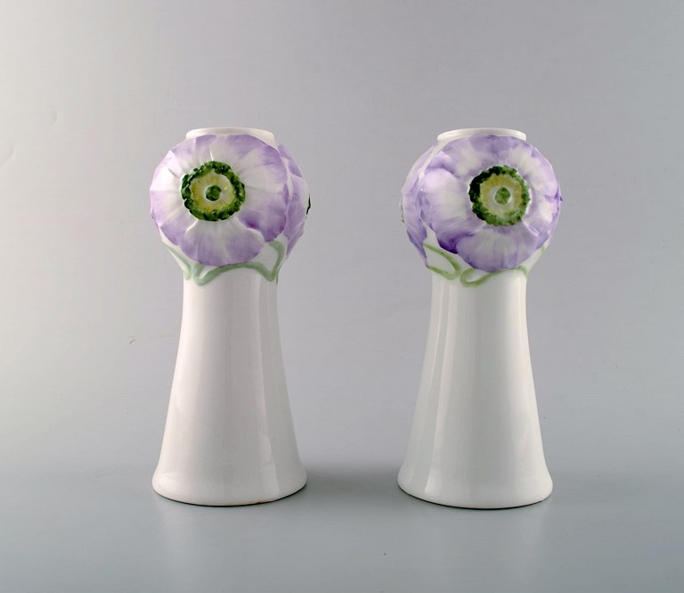 Rörstrand / Rorstrand. A pair of art nouveau vases in porcelain decorated with 
violet and green flowers in relief. Ca. 1900.