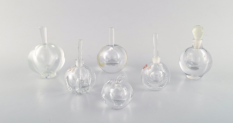 Edward Hald for Orrefors. A collection of six mouth blown flacons in clear art 
glass. Designed in the 1940