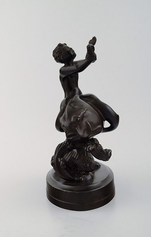 Just Andersen (1884-1943). Figur i disko metal i form af havdreng på fisk. 
1930/40´erne.