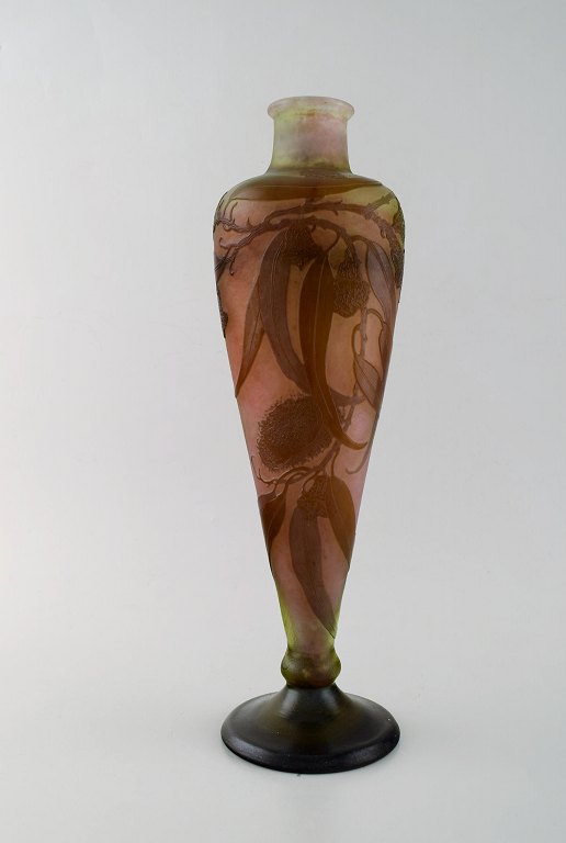 Emile Gallé vase in frosted and overlaid brown art glass carved with motifs in 
the form of flowers and leaves. Ca. 1910.
