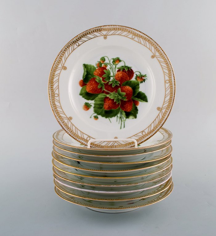 Royal Copenhagen. Ten very rare hand painted Flora Danica fruit plates. 
Strawberries, blackberries, ribs, plums, blackberries and more. Museum Quality. 
Ca. 1910.
