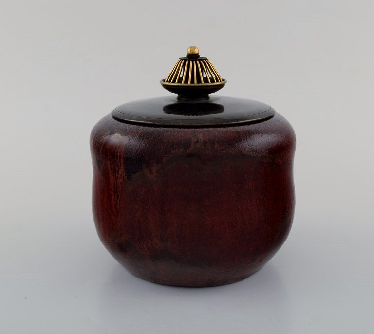 Patrick Nordstrøm / Carl Halier for Royal Copenhagen. Glazed ceramic vase with 
bronze lid. 1920